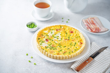 Chicken bacon quiche with scallions in a plate