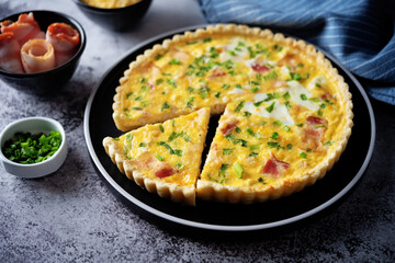 Chicken bacon quiche with scallions in a plate