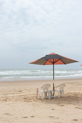 beautiful landscape with beach chair and a parasol on a sunny day.