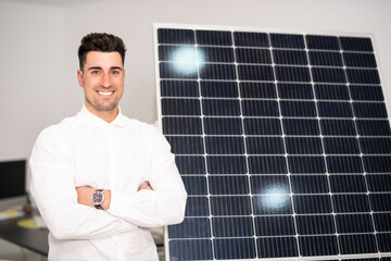 Solar energy seller posing near to panel in office