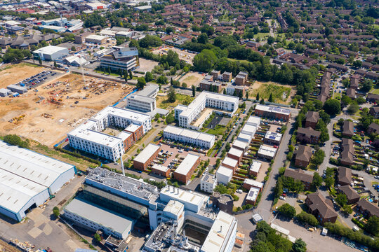 Aerial photo of the British town of Stevenage in Hertfordshire UK showing a a housing estate being built on a construction site on a hot sunny summers day