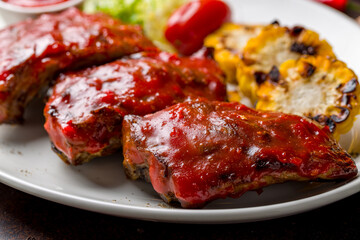 fried pork ribs in chili sauce macro close up