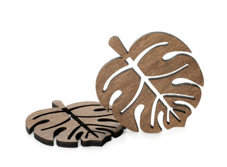 Leaf shaped wooden cup coasters on white background
