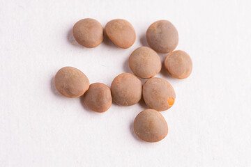 Lentils raw uncooked on white background