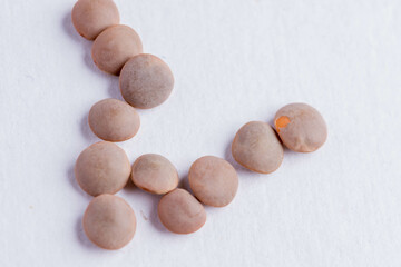 Lentils raw uncooked on white background
