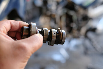 Close-up of the engine timing shaft for motorcycles.