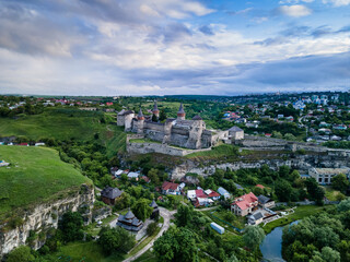 Aerial view of Kamianets-Podilskyi castle in Ukraine. The fortress located among the picturesque nature in the historic city of Kamianets-Podilskyi, Ukraine.
