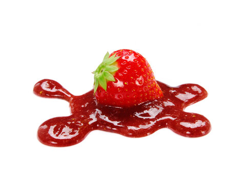 Strawberry fruit on strawberry jam isolated on white background.