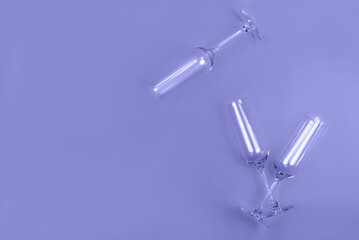 Champagne glasses in flat lay style with place for text. Mockup for your web banner design. Toned in trendy color of year 2022. Holiday concept.