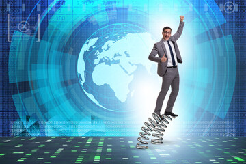 Businessman jumping high on springs