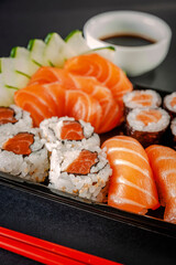 Salmon onigiri with salmon onigiri varieties on a delivery tray. Closeup.