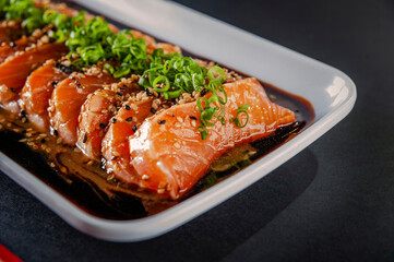 Salmon sashimi with shoyu and miso sauce.