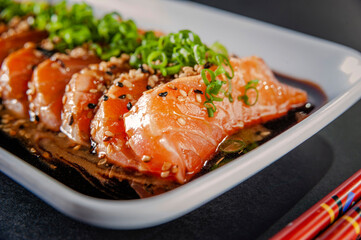 Salmon sashimi with shoyu and miso sauce.