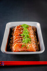 Salmon sashimi with shoyu and miso sauce.