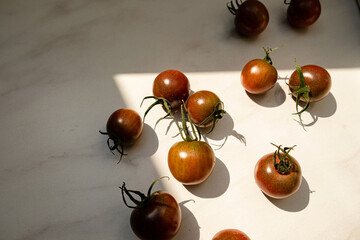 brown cherry tomatoes on the sunny background