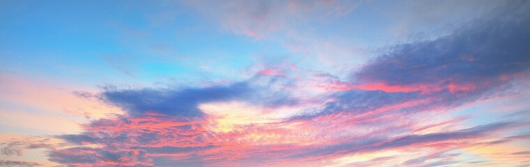 Clear blue sky, red, pink, golden cirrus and cumulus clouds after storm. Dramatic sunset cloudscape. Concept art, meteorology, heaven, hope, peace, graphic resources, picturesque panoramic scenery