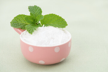 Kitchen mint and menthol isolated on green background.