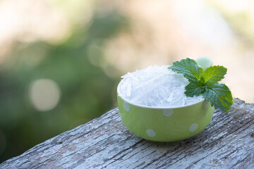 Kitchen mint and menthol on bokeh nature background.