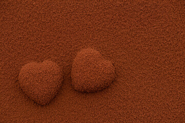 Heart shape chocolate and powder background.top view.