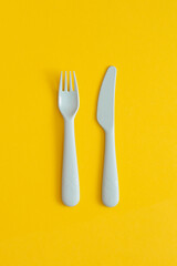 Food plastic packaging on yellow background. Concept of Recycling plastic and ecology.