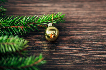 Christmas Tree Branches on a Brown Background with CopySpace for Text