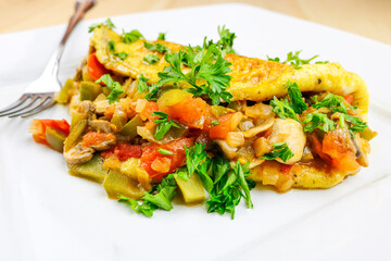 Mexican omelet set on a white plate.