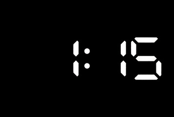 Real white led digital clock on black background