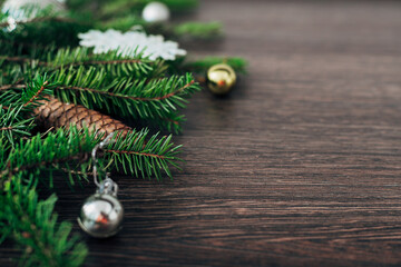 Christmas Tree Branches on a Brown Background with CopySpace for Text