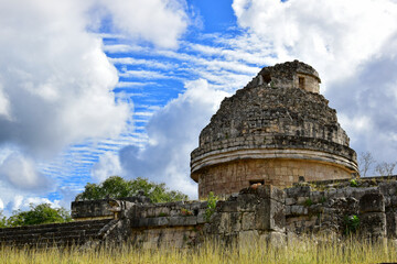 Mayan temple in the area of Chichen itza with beautiful clouds and sky, Yucatan, Mexico