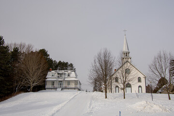 Old church in the Canadian winter in the province of Quebec