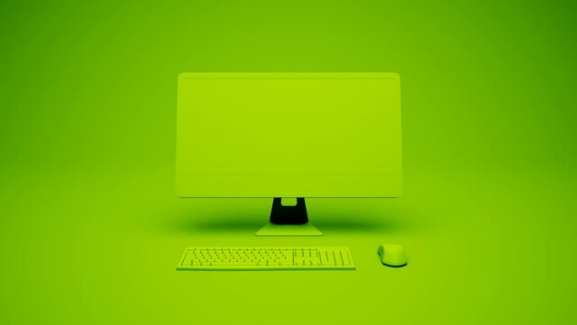 Isolated modern computer on green background build with keyboard and mouse.
