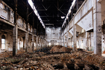 Fototapeta premium Old abandoned large industrial hall waiting for demolition