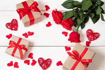 Gift boxes in craft paper with red ribbon. Eco style for valentine's day.