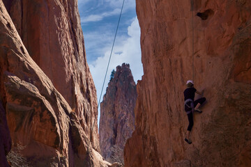 Young Woman Rock Climbing