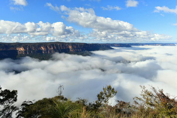 Mist in the valley as seen from Sublime Point Lookout at Leura in the Blue Mountains of Australia