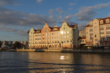 Authentic buildings on Pregolya river near Fishing Village at sunset light, Kaliningrad, Russia