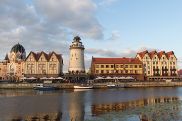 The Fishing Village and lighthouse on the banks of Pregolya River at sunset light, Kaliningrad,...