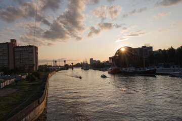 Naklejka premium Ships at pier of Pregolya River near World Ocean Museum at sunset light, Kaliningrad, Russia