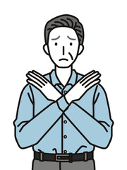 手でばつのジェスチャーをするシニア男性