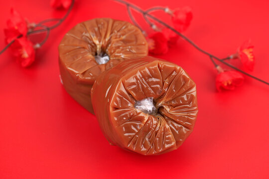 Chinese New Year Cake opular as Kue Keranjang or Dodol China in Indonesia. Served on Bamboo Plate, Imlek Red Decoration