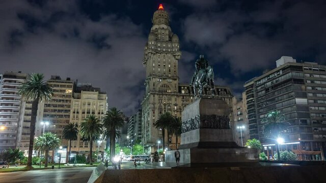 Time lapse view of Independence Square showing historical landmark Artigas Mausoleum at night in the Old Town district of Montevideo, Uruguay.