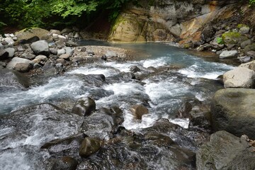 Naklejka na ściany i meble trekking around river and waterfall in summer