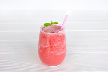 Strawberry yogurt fruit juice smoothie pink colorful fruit juice milkshake blend beverage healthy high protein the taste yummy In glass drink episode morning on white wood background.