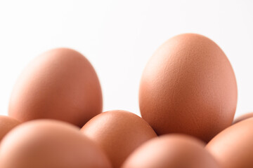 Fresh organic chicken eggs on white background.