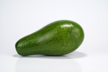 Whole and split avocado on white background