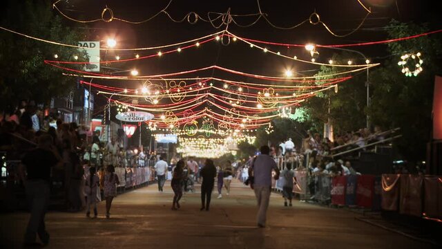 Illuminated Street at the Artisanal Carnival in Lincoln, Festive Lights are being Displayed over the Street, Buenos Aires Province, Argentina. 4K Resolution.