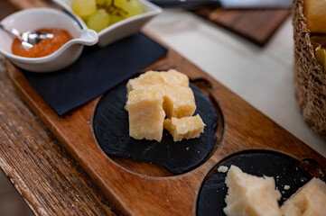 Tasting of different matured and old parmesan Parmigiano-Reggiano hard cheese in Parma, Emilia Romagna, Italy