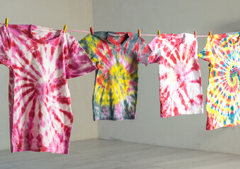 The drying process of T-shirts painted in tie dye style.
