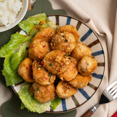 Deep fried cuttlefish ball with salted egg yolk coating