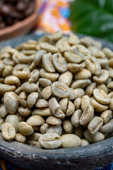Green and roasted coffee beans from South America coffee producing region, from Colombia and Brazil with  mountain ranges and climate ideal for coffee growing